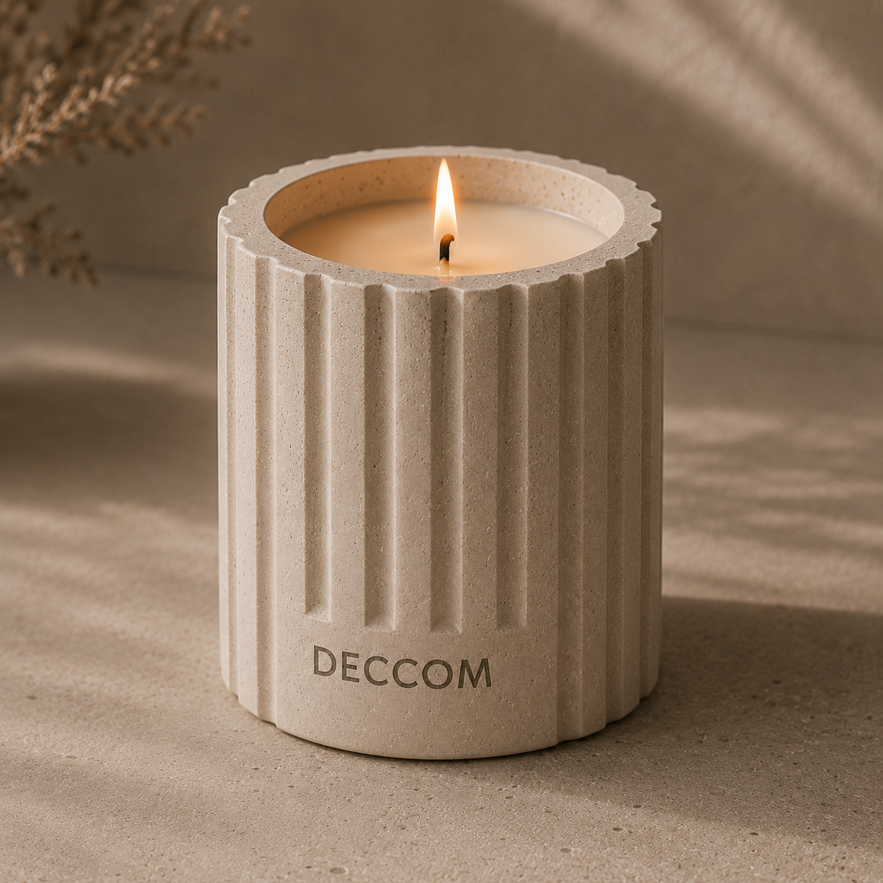 Close-up of DECCOM Column Vessel soy candle showing fluted architectural design and matte stone texture