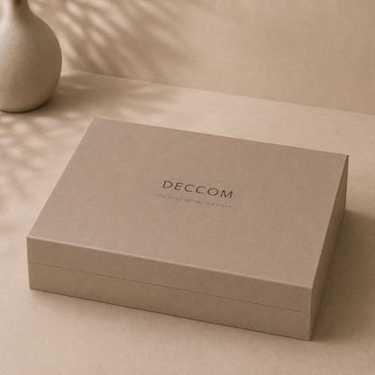 Closed DECCOM Sand Ritual magnetic gift box in warm neutral stone finish
